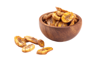 a bowl of bananas sitting next to a pile of nuts