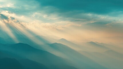 Obraz premium Beautiful Mountain Landscape with Sun Rays Breaking Through Clouds and Mist.