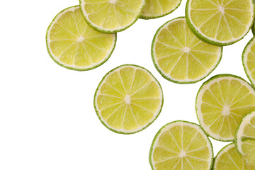 Fototapeta premium a group of lime slices on a white surface
