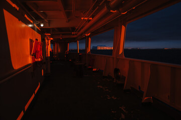 Passengers on board a Ship enjoy the late sunset in Antarctica