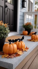 Spooky decorations transform the front door into a Halloween display filled with pumpkins, autumn leaves, and playful bats