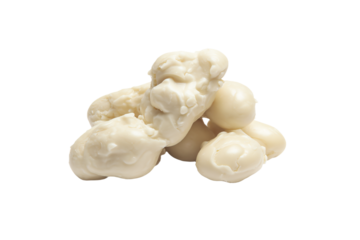 a pile of white chocolates with a teddy bear on top
