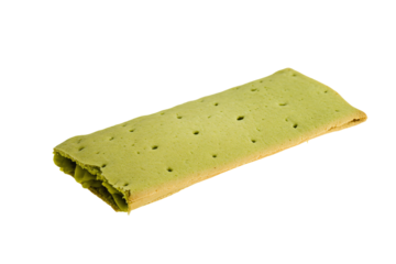 a piece of green food on a white surface