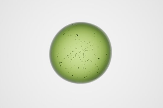 Translucent green glass sphere with suspended bubbles inside, isolated on plain background, abstract 3D molecular structure for science, biology, chemistry, healthcare or futuristic technology visuals