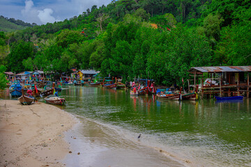 Small fishing village on a river located south of Patong on the island of Phuket. Long Tail boats are used for tourists and for fishing