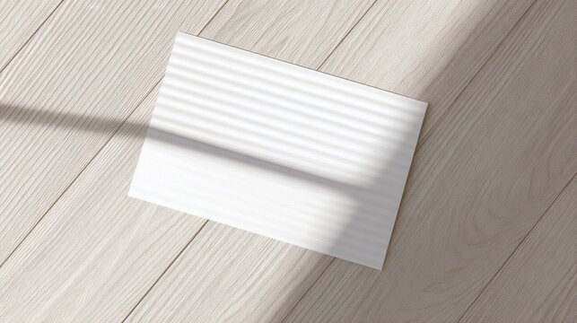 A blank notecard on light wood, embodying simplicity and natural beauty.
