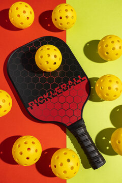 pickleball paddle and balls on vibrant background