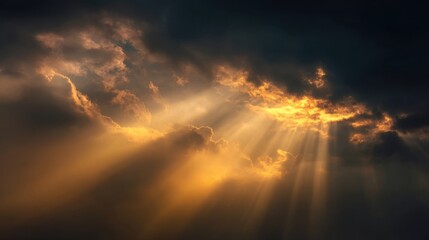 Dramatic sky with dark clouds and golden sunlight rays breaking through atmospheric storm.