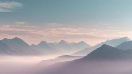 Fototapeta premium Majestic mountain landscape with layered peaks and misty valley at sunrise.