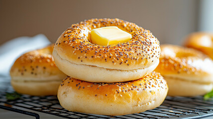 Freshly baked bagels topped with butter