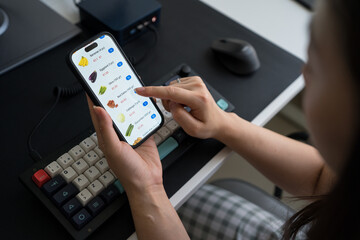 Unrecognizable woman shopping groceries online at home