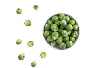 a bowl of brussels sprouts on a white surface