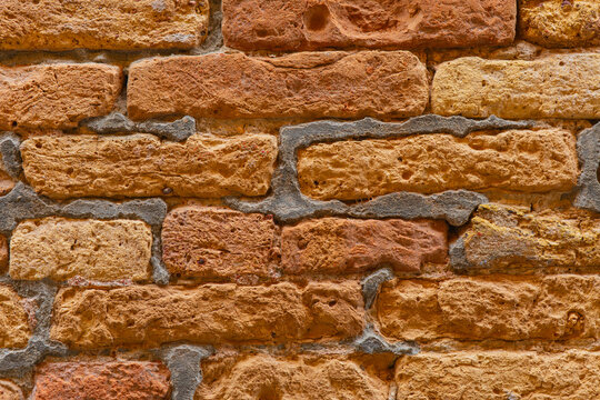 Fototapeta Close-up of rustic textured brick wall surface