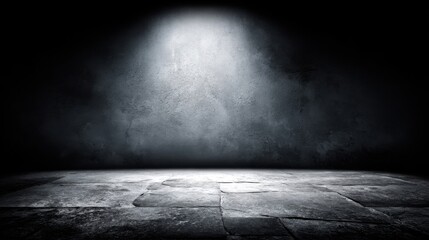 Dark empty stage with spotlight and textured concrete floor for theatrical performance.