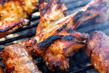 Pork chops, steak, sausages on barbecue grill