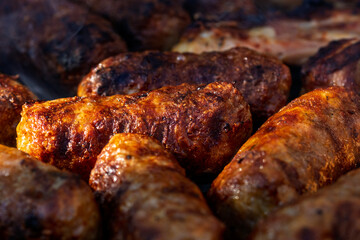 Pork chops, steak, sausages on barbecue grill