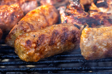 Pork chops, steak, sausages on barbecue grill