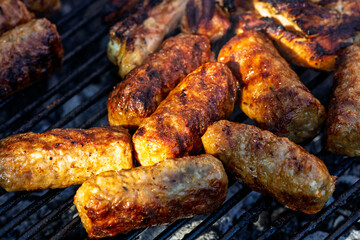 Pork chops, steak, sausages on barbecue grill