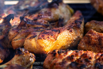 Pork chops, steak, sausages on barbecue grill