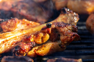 Pork chops, steak, sausages on barbecue grill