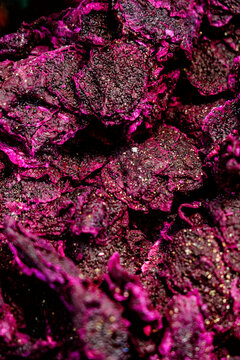 Vibrant magenta dried dragon fruits with detailed texture