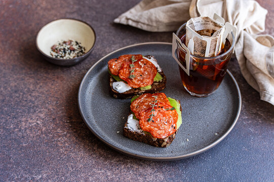 Whole wheat bread with pepperoni and drip coffee