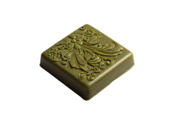 a green soap bar with a decorative design