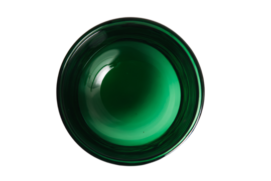 a green glass bowl with a white background