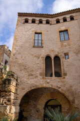 Historic Casa Sefus, Tarraco Viva Office in Tarragona, Catalonia, Spain. Cultural Roman-themed building in Mediterranean architecture.