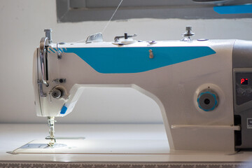 Industrial Sewing Machine and Precision Needle Mechanism in Tailor Workshop