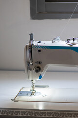Industrial Sewing Machine and Precision Needle Mechanism in Tailor Workshop