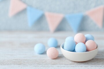 sweets and tri-color decorations on wooden table under soft lighting