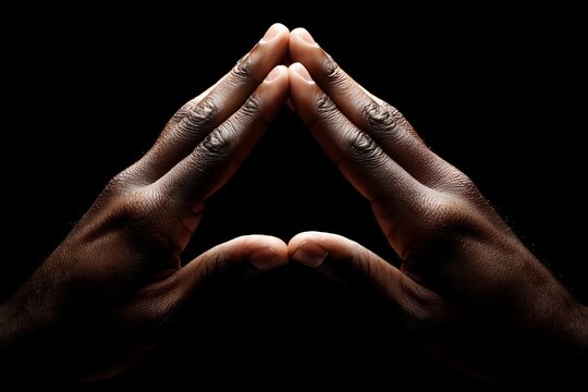 Artistic image of hands in a triangle shape against a dark background - Powered by Adobe