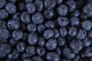 Close-up of blueberries on a wooden tray