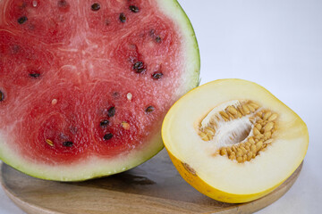 Sliced watermelon and melon on a light background