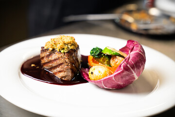 Gourmet beef steak with wine sauce and vegetables