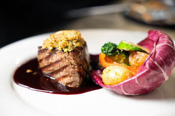 Gourmet beef steak with wine sauce and vegetables