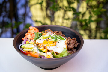 Korean beef rice bowl with fried egg – front view