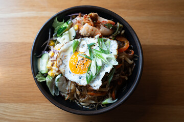 Bibimbap bowl with fried egg – top view