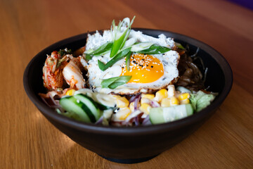 Korean bibimbap bowl with fried egg
