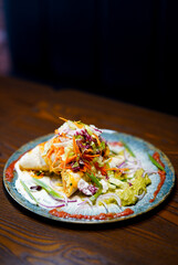 Colorful burritos with fresh toppings – restaurant serving