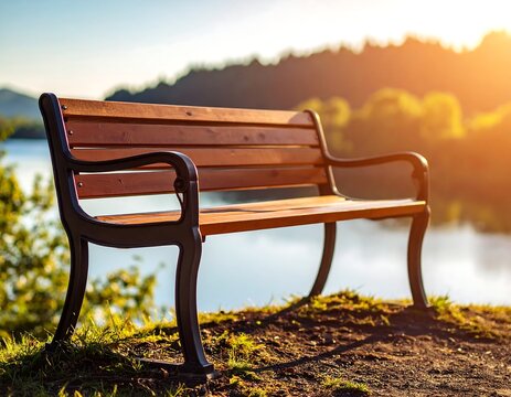 Park bench by a lake at sunrise