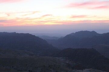 Fototapeta premium Mountain Sunset over Layered Peaks