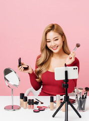 Young Asian Makeup Artist Filming Beauty Video with Tripod Camera