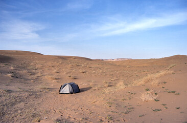 A Tent In Middle of the Arab Desert Landscape On Blurry Background