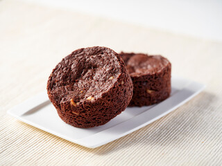 Rich Dark Chocolate Walnut Brownies fudgy texture and visible nut pieces in rectangular plate side view of cafe menus