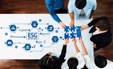A group of professionals collaborating on a green business strategy, highlighting ESG principles...