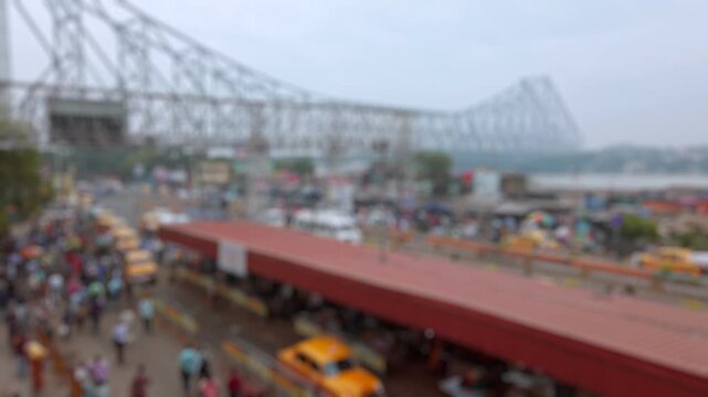 Bokeh view of road traffic at the streets of Kolkata near the Howrah railway station in Calcutta, India. Blurred background footage.