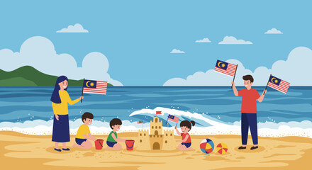 A family having fun on a beach building a sandcastle while waving Malaysian flags.