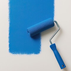 Obraz premium Blue paint roller and blue paint on a white background